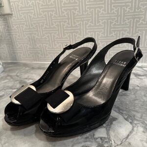 Peep toe, patent leather pumps.